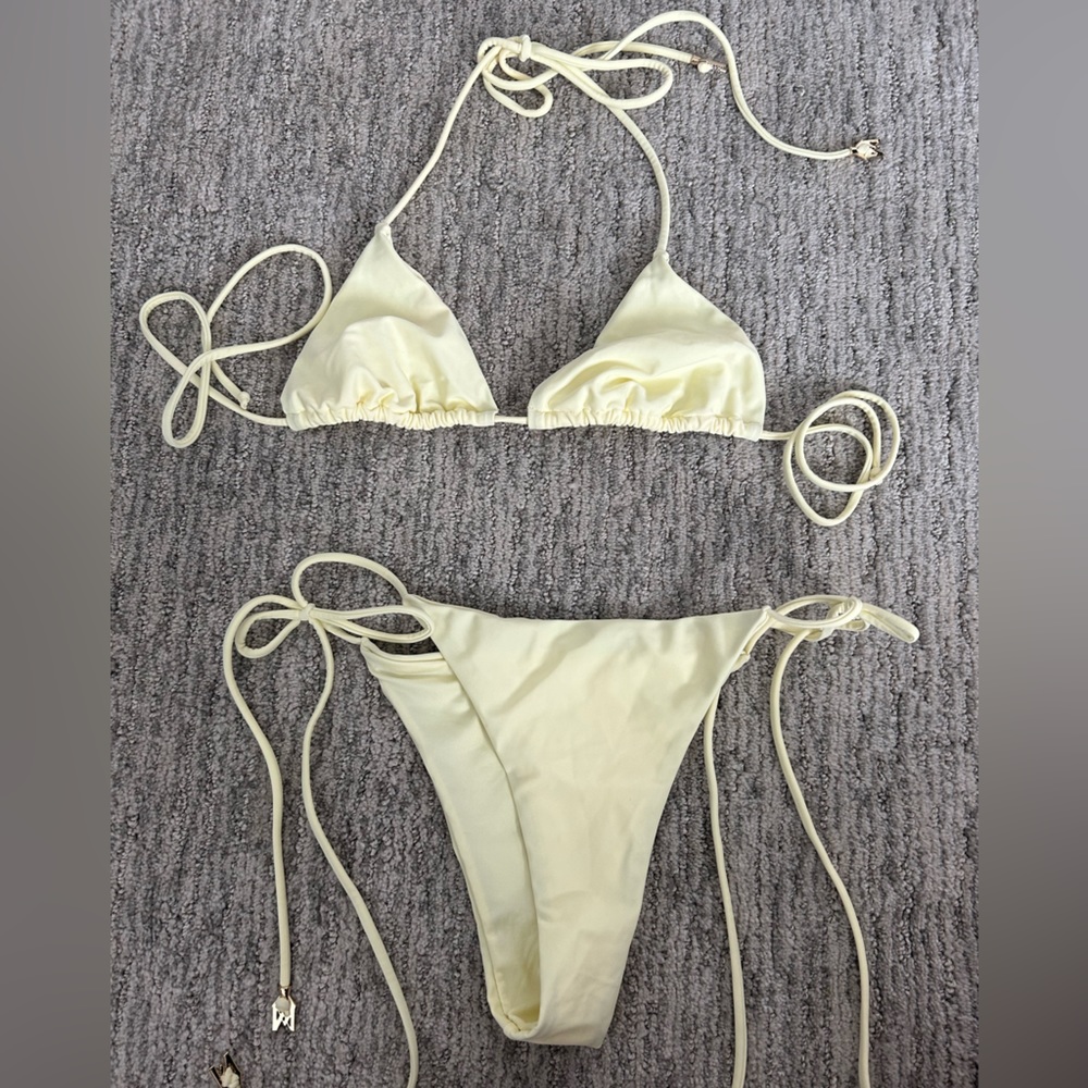 Pastel yellow adjustable string bikini.